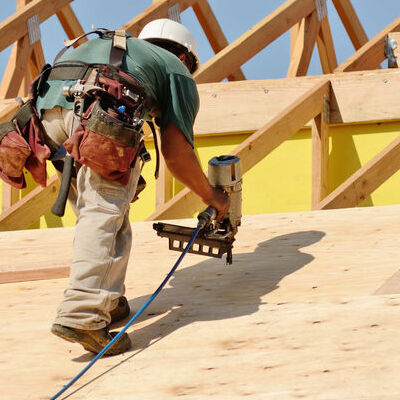 A Roofer Works on a Roof Installation.