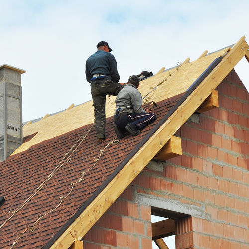Roofers Installing Shingles.