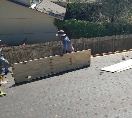 working on a roof installation