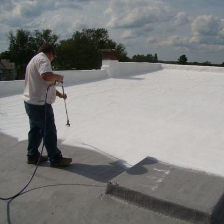 A Roofer Sprays on a Roof Coating.